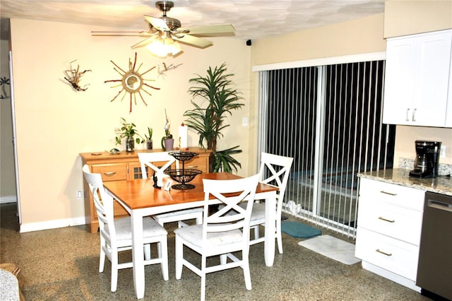 dining space featuring a ceiling fan and baseboards