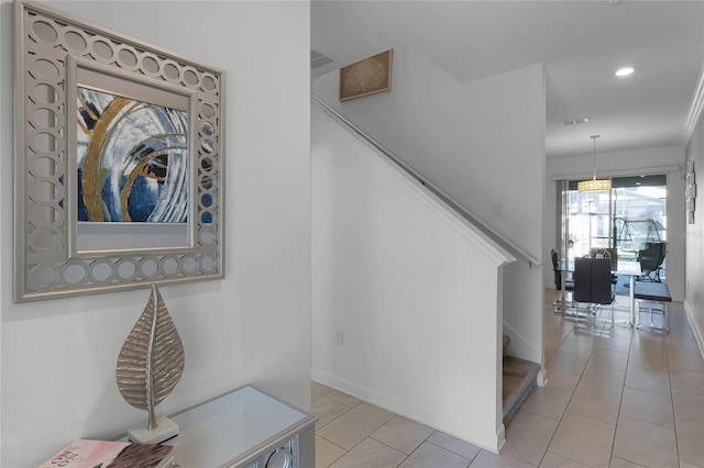 stairway with tile patterned flooring