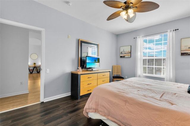 bedroom featuring ceiling fan and dark hardwood / wood-style floors