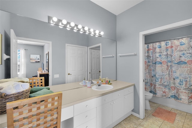 full bathroom featuring tile patterned floors, shower / bath combo with shower curtain, vanity, and toilet