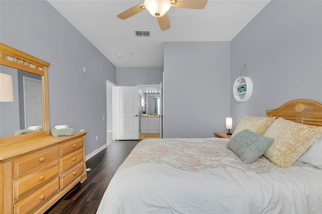 bedroom with ensuite bath, ceiling fan, and dark hardwood / wood-style flooring