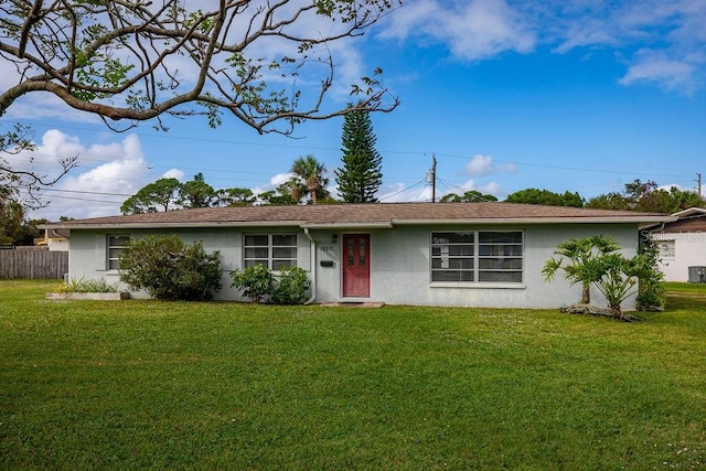 ranch-style home with a front lawn