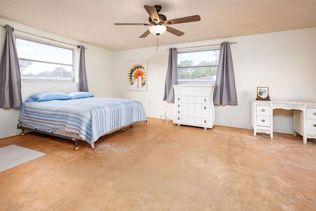 bedroom with multiple windows and ceiling fan