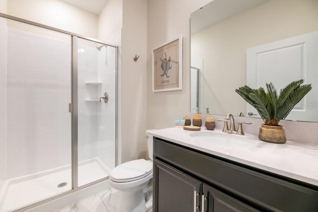 bathroom featuring walk in shower, vanity, and toilet