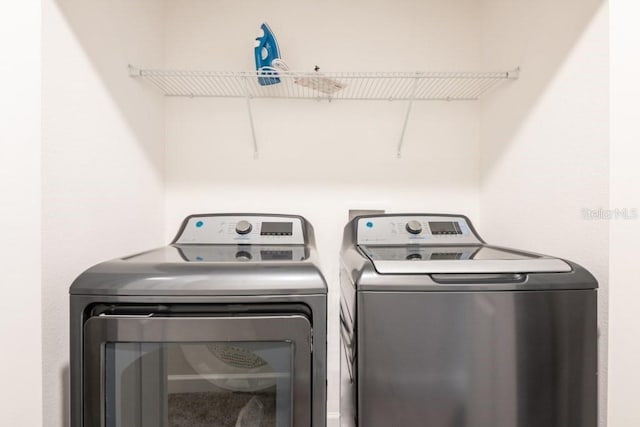 laundry area with separate washer and dryer