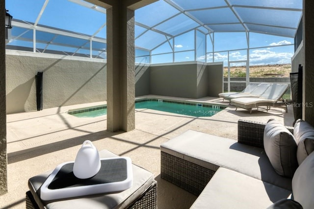 view of pool with a lanai, a patio, and an outdoor living space