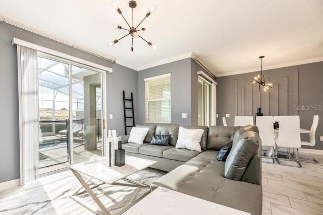 living room with an inviting chandelier and ornamental molding