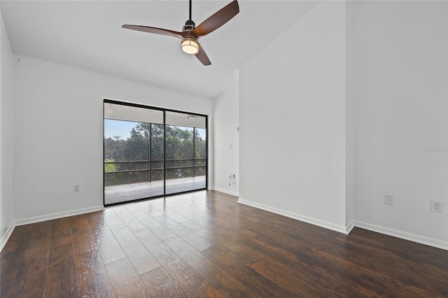 spare room featuring dark hardwood / wood-style flooring, a textured ceiling, and ceiling fan