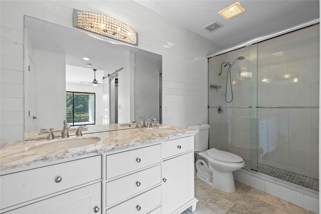 bathroom featuring walk in shower, vanity, a textured ceiling, and ceiling fan