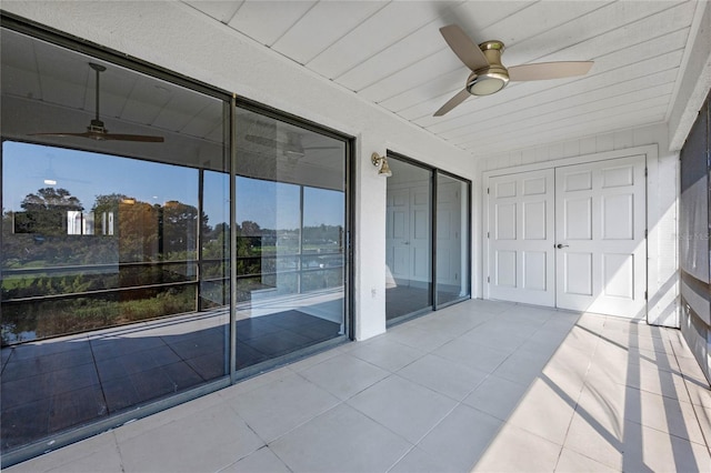 sunroom with wooden ceiling and ceiling fan