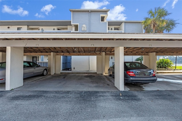 view of vehicle parking with a carport