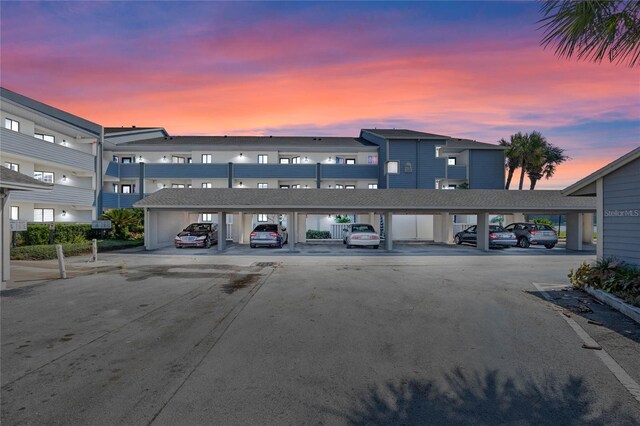 view of outdoor building at dusk