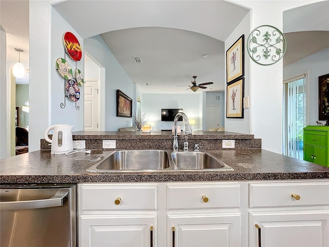 kitchen featuring dishwasher, sink, ceiling fan, and white cabinets