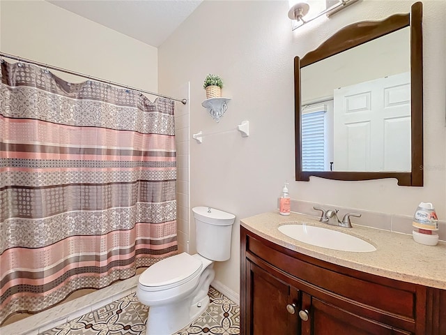 bathroom with toilet, a shower with curtain, vanity, and tile patterned flooring