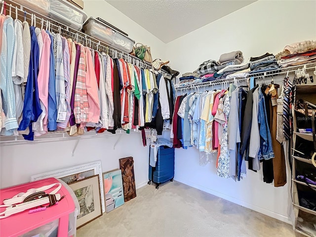 spacious closet featuring carpet floors