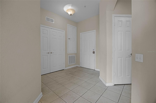 interior space featuring light tile patterned floors