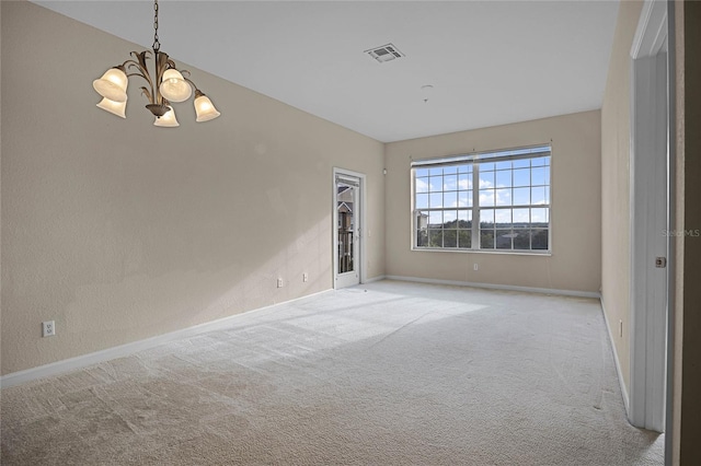 unfurnished room featuring light carpet and an inviting chandelier