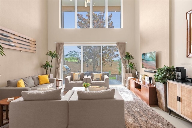 living room with a towering ceiling