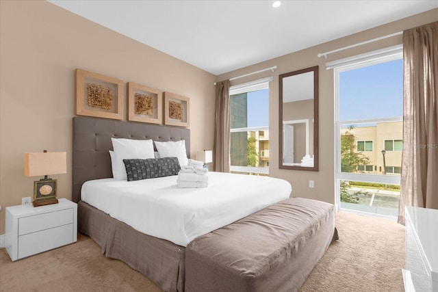 bedroom with light colored carpet