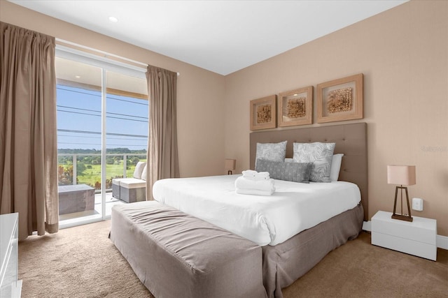 bedroom featuring access to outside and carpet flooring