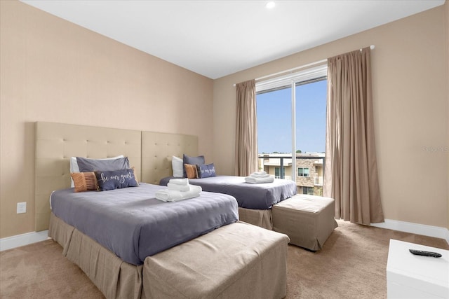 bedroom featuring light colored carpet