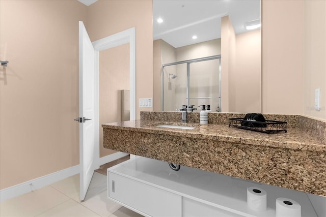 bathroom featuring tile patterned flooring and sink