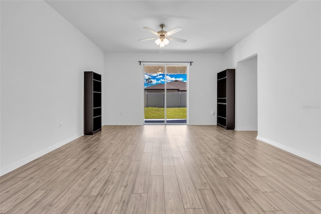 unfurnished room featuring light hardwood / wood-style floors and ceiling fan