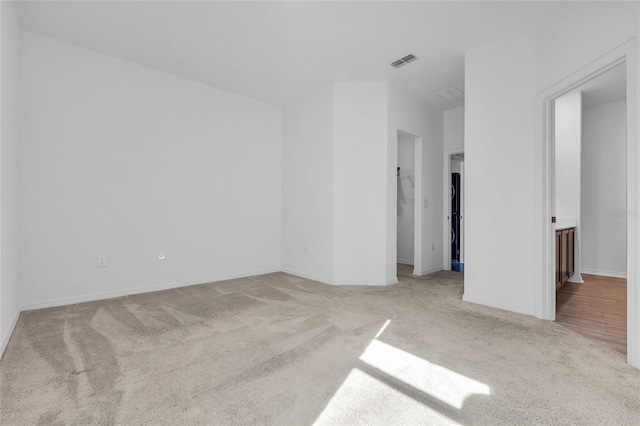 spare room with light carpet