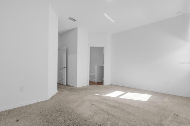 unfurnished bedroom with light colored carpet