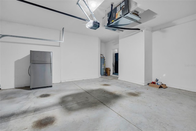 garage with water heater, a garage door opener, and stainless steel refrigerator