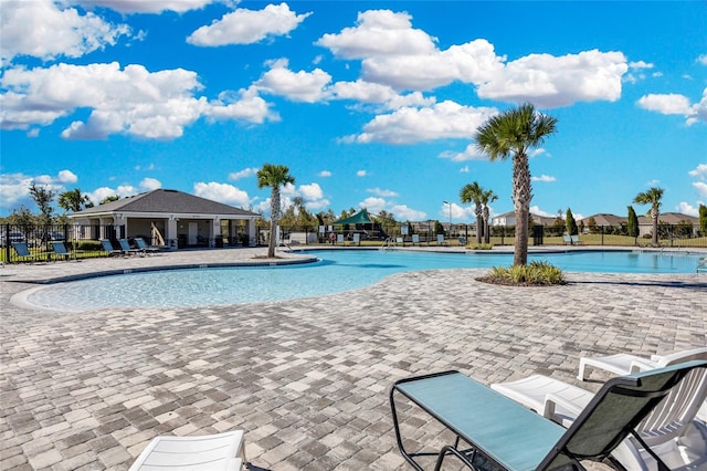 view of swimming pool with a patio