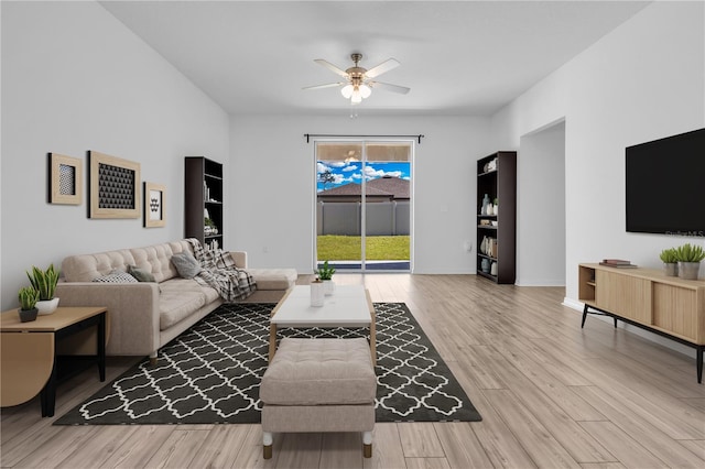 living room with hardwood / wood-style flooring and ceiling fan