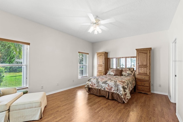 bedroom with hardwood / wood-style floors and ceiling fan