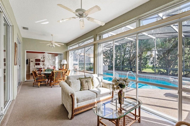 sunroom with ceiling fan