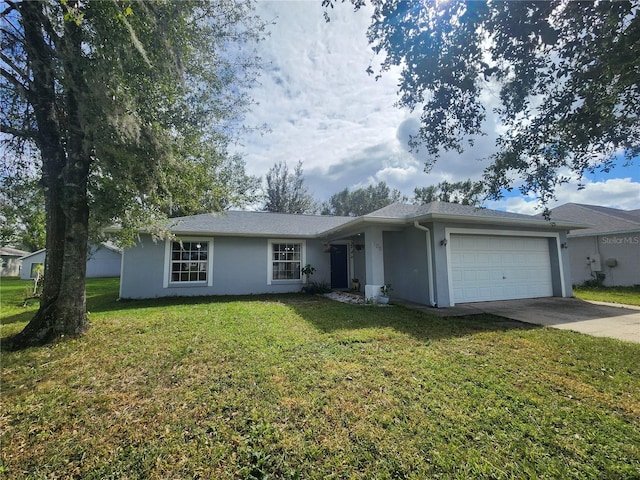 single story home featuring a garage and a front yard