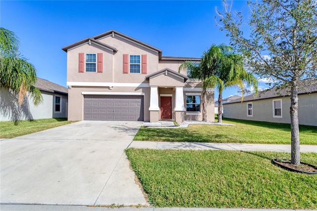 view of front of property featuring a garage and a front yard