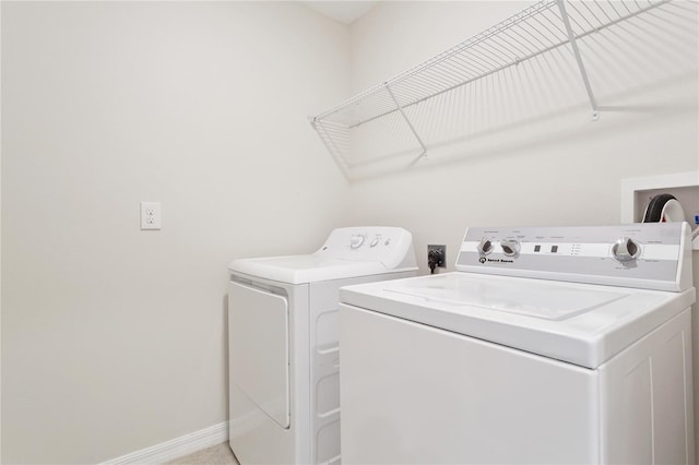 washroom with independent washer and dryer