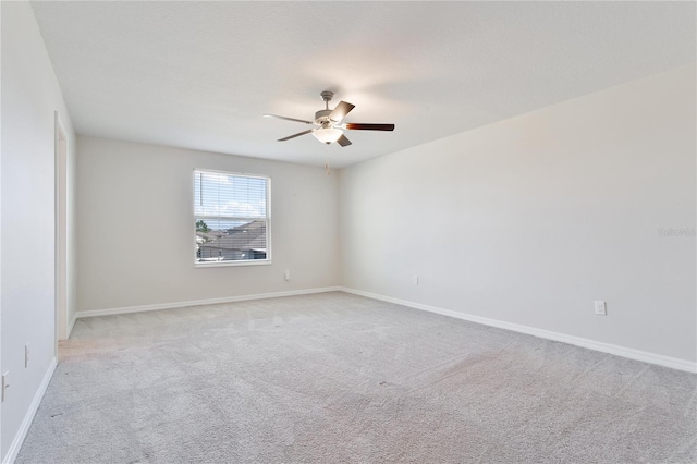 unfurnished room with light carpet and ceiling fan