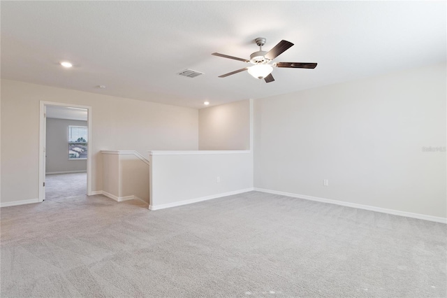 carpeted empty room with ceiling fan