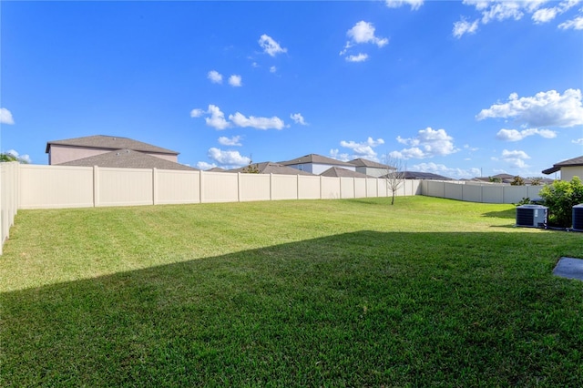 view of yard featuring central air condition unit