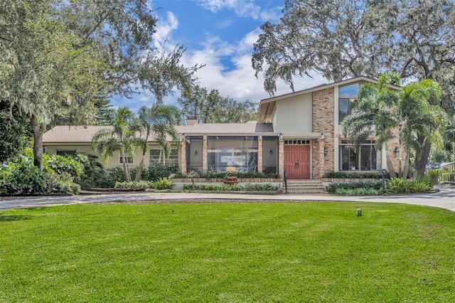 view of front of home with a front lawn