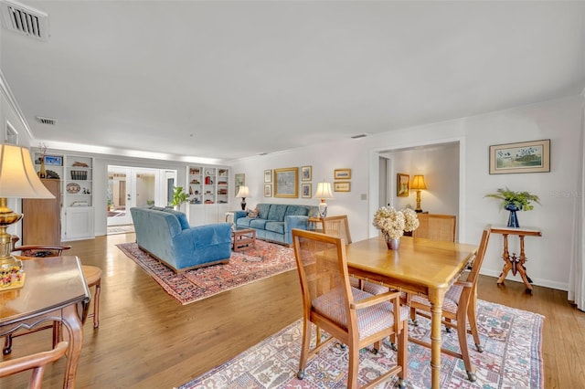 dining room featuring french doors and hardwood / wood-style flooring