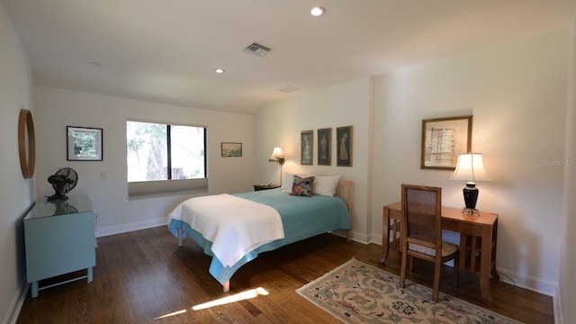 bedroom featuring dark hardwood / wood-style flooring