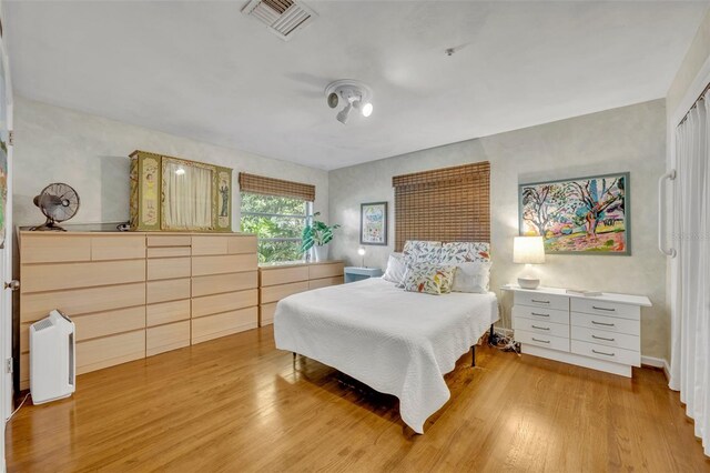 bedroom with hardwood / wood-style floors