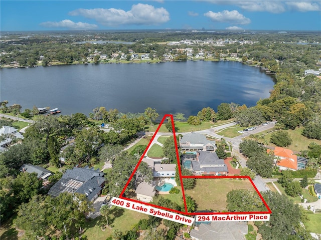 birds eye view of property with a water view