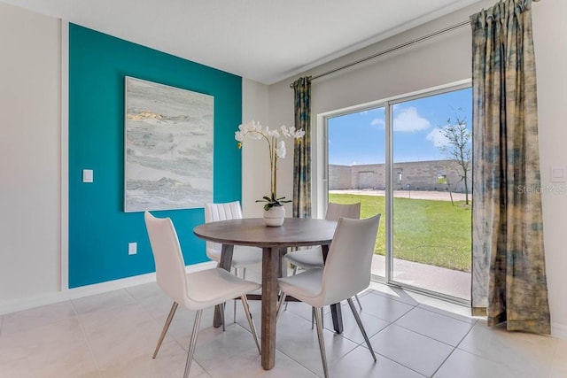 dining area featuring light tile patterned floors