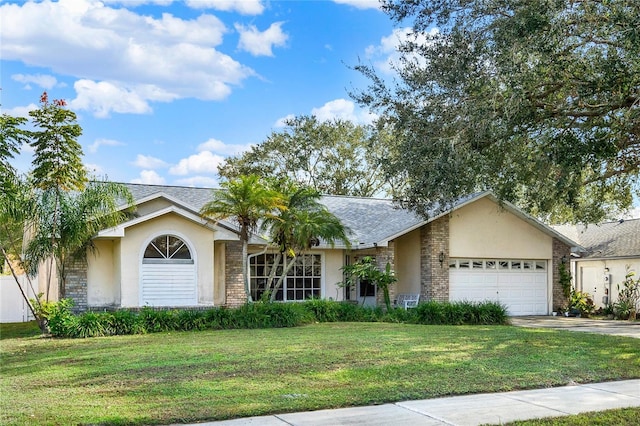 ranch-style home with a garage and a front lawn