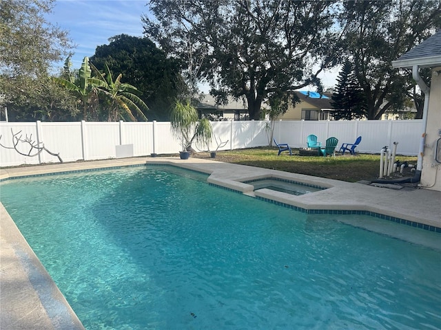 view of pool with an in ground hot tub