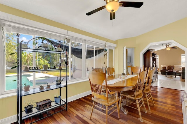 dining room with hardwood / wood-style floors and ceiling fan