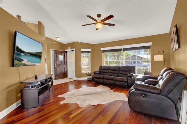 living room with hardwood / wood-style flooring, ceiling fan, and lofted ceiling